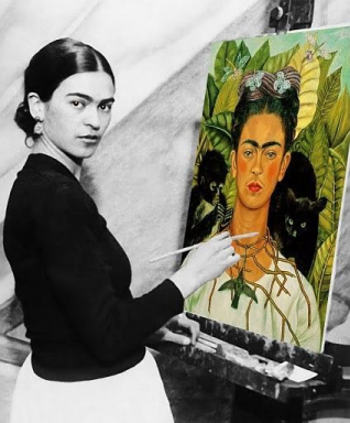 Frida while working on her famous painting  Self-Portrait with Thorn Necklace and Hummingbird, 1940