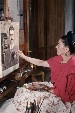 Frida while doing painting Portrait of My Father, 1951 